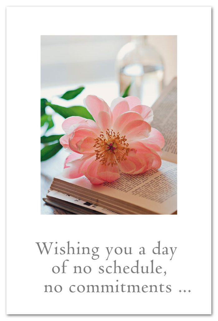 Pink flowers on book birthday card.